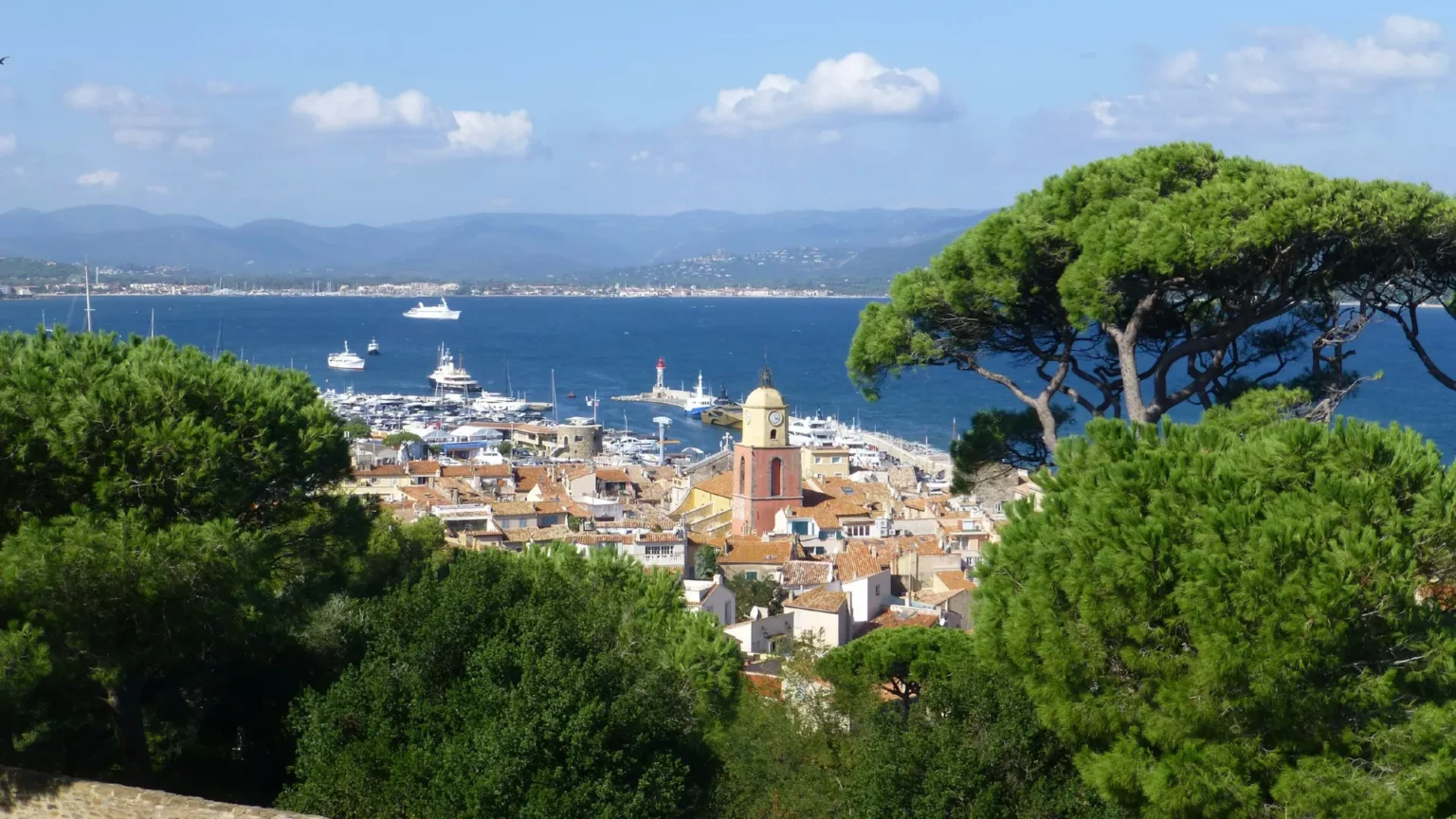 Panoramic view of Saint-Tropez coastline and Vieux Port from Citadel during exclusive private tour with VTDriver luxury chauffeur service
